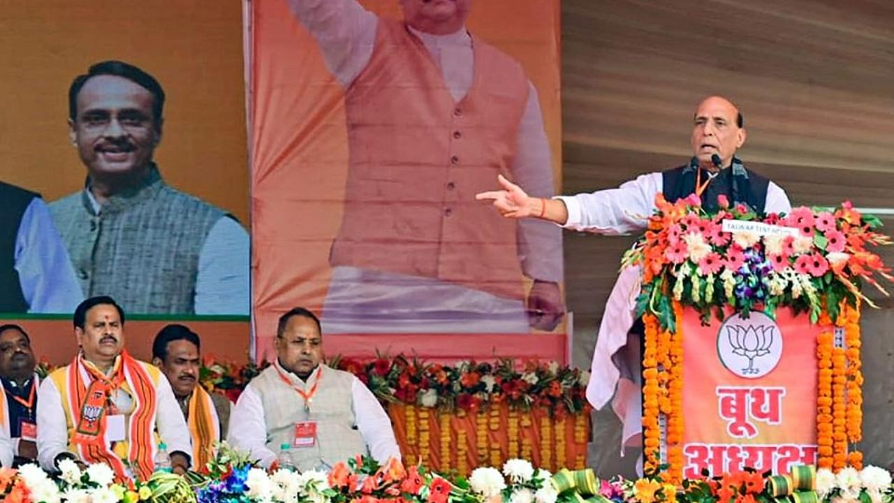 Defence Minister Rajnath Singh (R) speaks as Deputy Chief Minister of Uttar Pradesh Dinesh Sharma and other state ministers look on during 'Booth Adhyaksh Sammelan', ahead of the Uttar Pradesh Assembly Elections in 2022, in Sitapur district. Credit: PTI photo