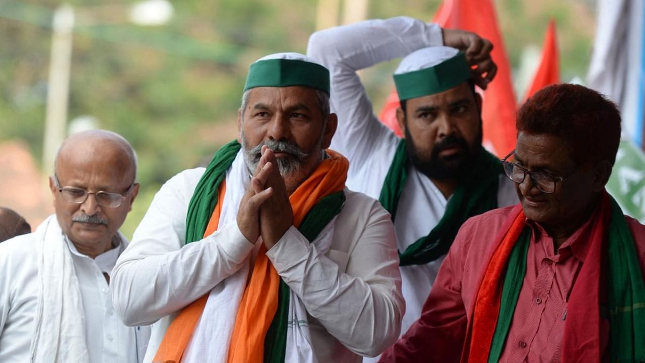 Bharatiya Kisan Union (BKU) leader Rakesh Tikait (C) along with members of All India Kisan Sangharsh Coordination Committee (AIKSCC) gestures during a protest to mark one year since the introduction of divisive farm laws and to demand the withdrawal of the Electricity Amendment Bill, in Hyderabad. Credit: AFP Photo