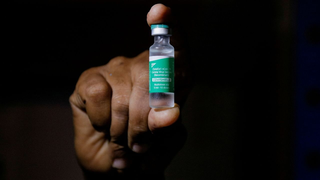 A man displays a vial of the Covishield vaccine as Ghana received a batch under the COVAX exports. Credit: Reuters Photo