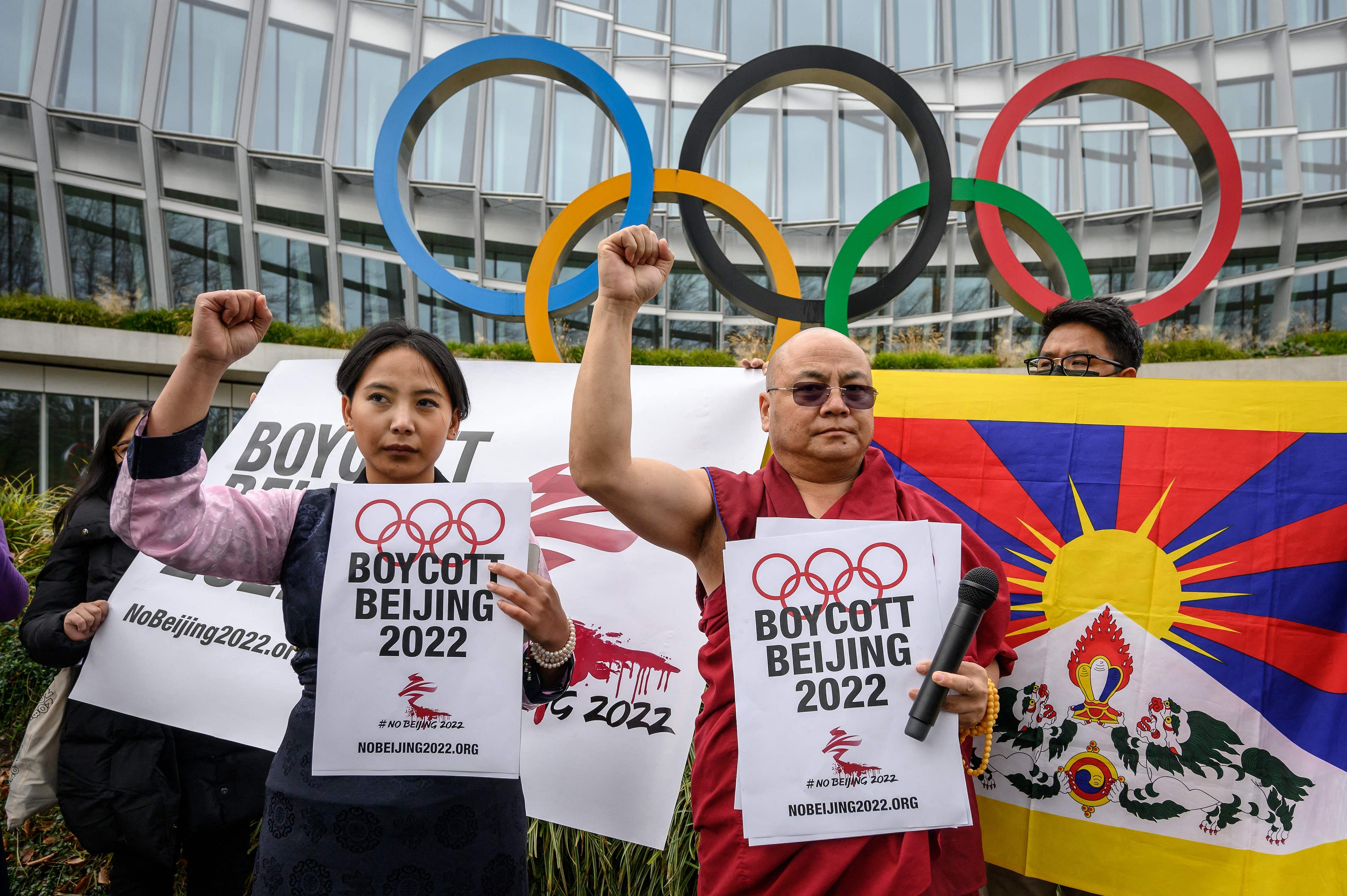 Tibetan activists stand in front of the International Olympic Committee (IOC) headquarters during a protest ahead of the February's Beijing 2022 Winter Olympics, on November 26, 2021 in Lausanne. Credit: AFP Photo
