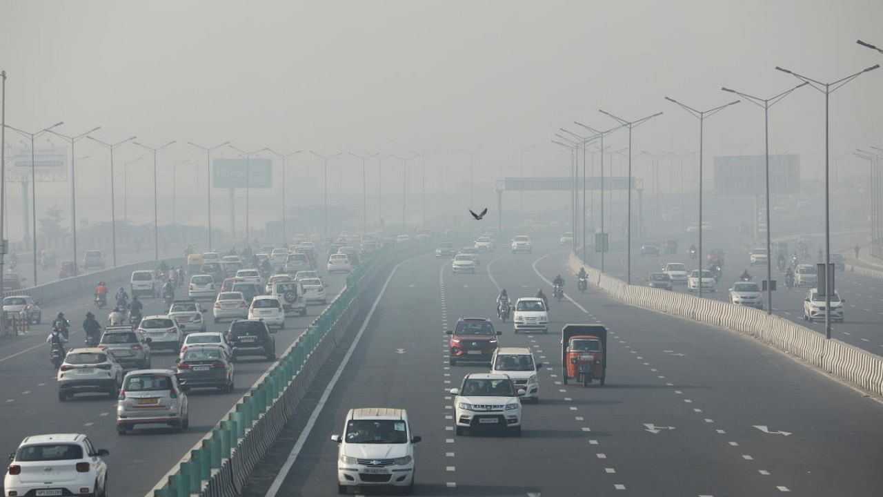 Vehicles are seen shrouded in smog on a highway in New Delhi. Credit: Reuters File Photo