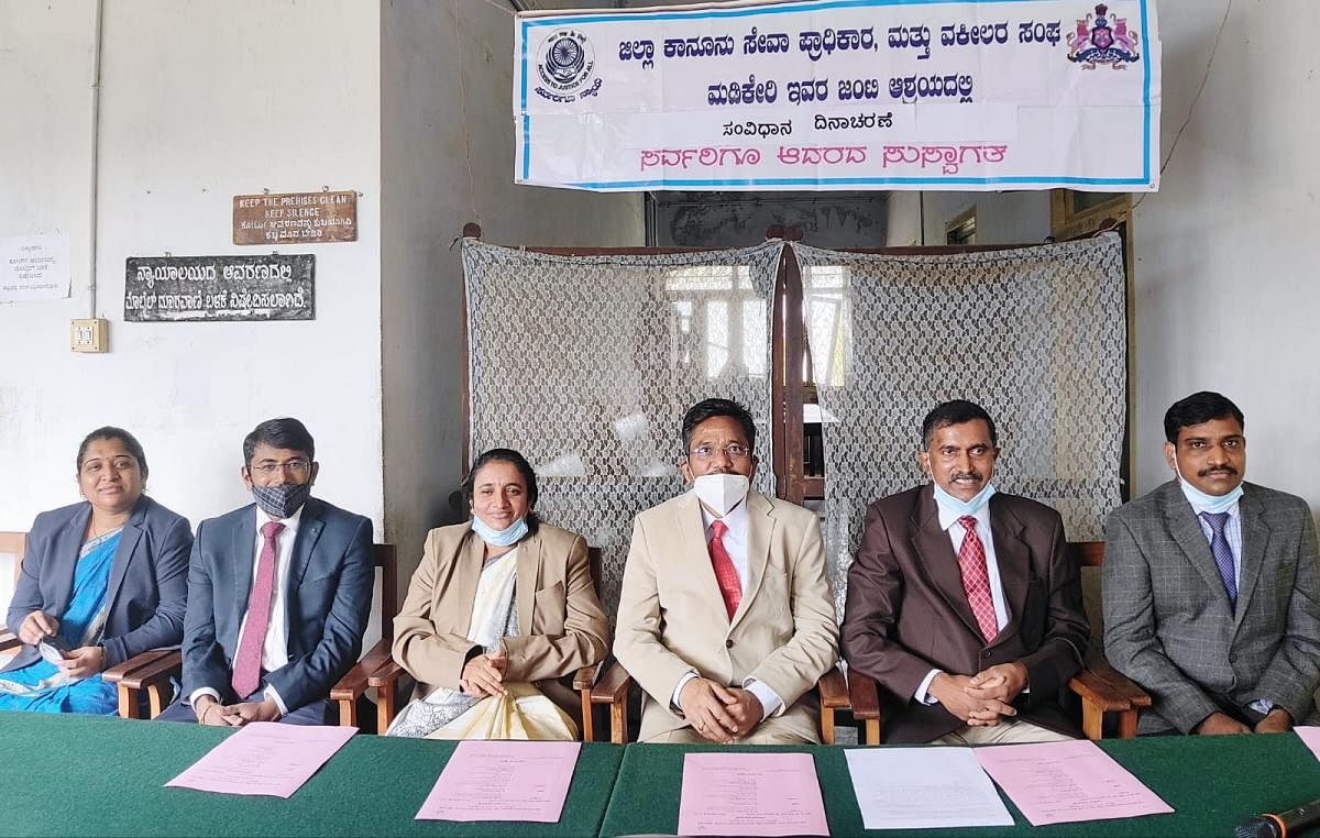 District and Sessions Court Judge B L Jinaralkar and others during the Constitution Day programme observed on the premises of the court in Madikeri.