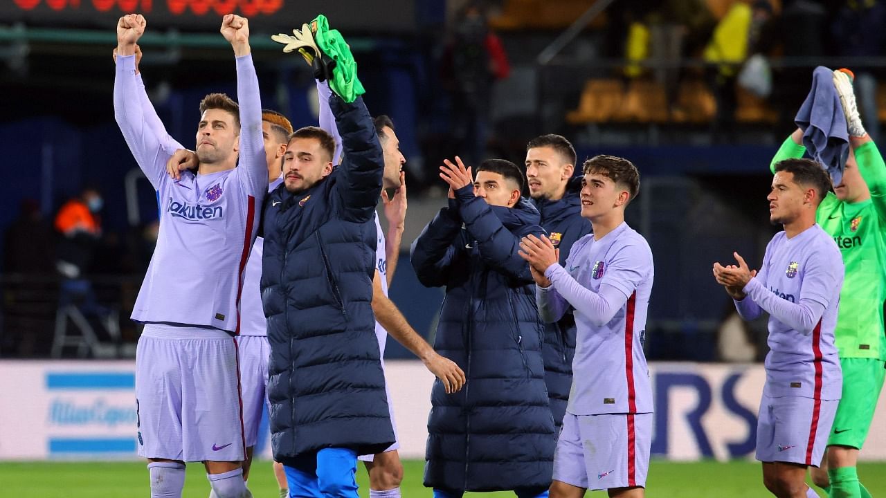 Barcelona's players celebrate their victory. Credit: AFP Photo