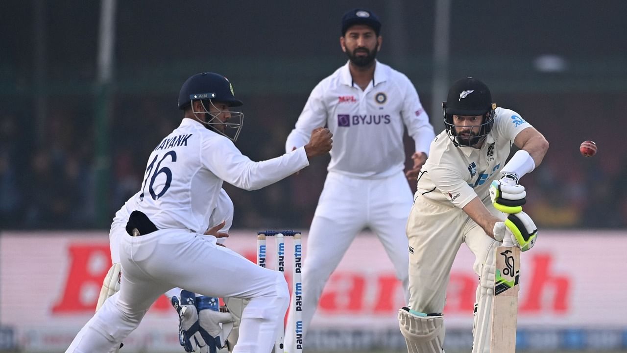 New Zealand's William Somerville (R) plays a shot during the fourth day of the first Test cricket match against India at the Green Park Stadium in Kanpur. Credit: AFP Photo