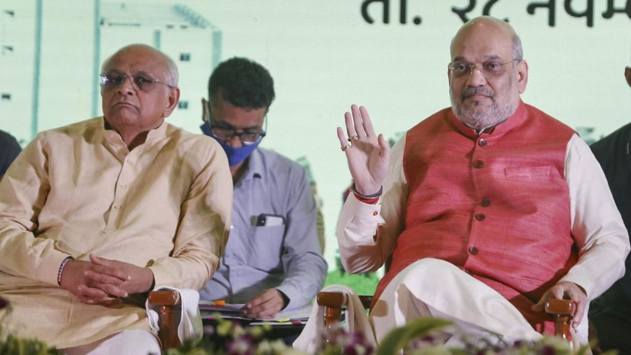 Union Home Minister Amit Shah along with Gujarat Chief Minister Bhupendra Patel attends the inaugural ceremony of a new mega milk powder plant and new packaging film plant of Amul, in Gandhinagar. Credit: PTI Photo