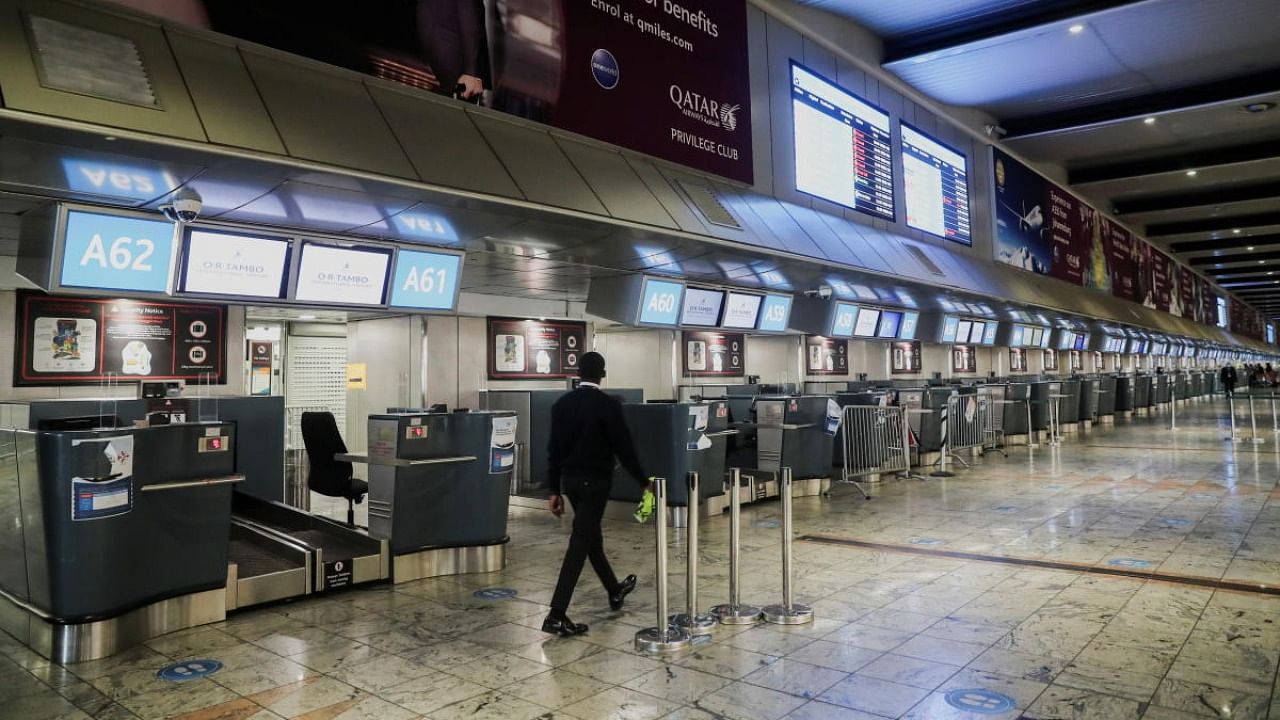 International check-in counters stand empty as several airlines stopped flying out of South Africa, amidst the spread of the new SARS-CoV-2 variant Omicron, at O.R. Tambo International Airport, in Johannesburg. Credit: Reuters photo