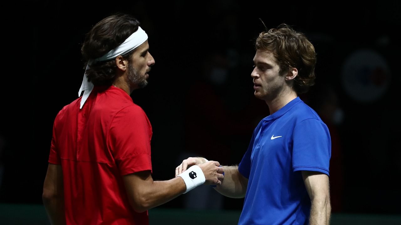 Russian Tennis Federation's Andrey Rublev with Spain's Feliciano Lopez after their double match. Credit: Reuters Photo