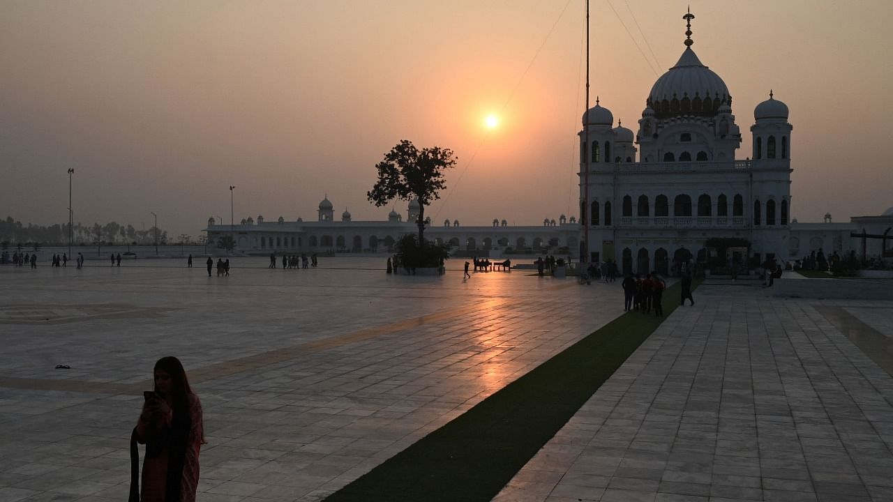 Sikh pilgrims arrive to take part in a religious ritual on the eve of the birth anniversary of Guru Nanak, founder of Sikhism, at the Gurdwara Darbar Sahib in Kartarpur. Credit: AFP File Photo