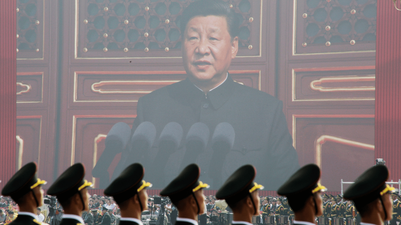 Soldiers of People's Liberation Army (PLA) are seen before a giant screen as Chinese President Xi Jinping speaks at the military parade. Credit: Reuters Photo
