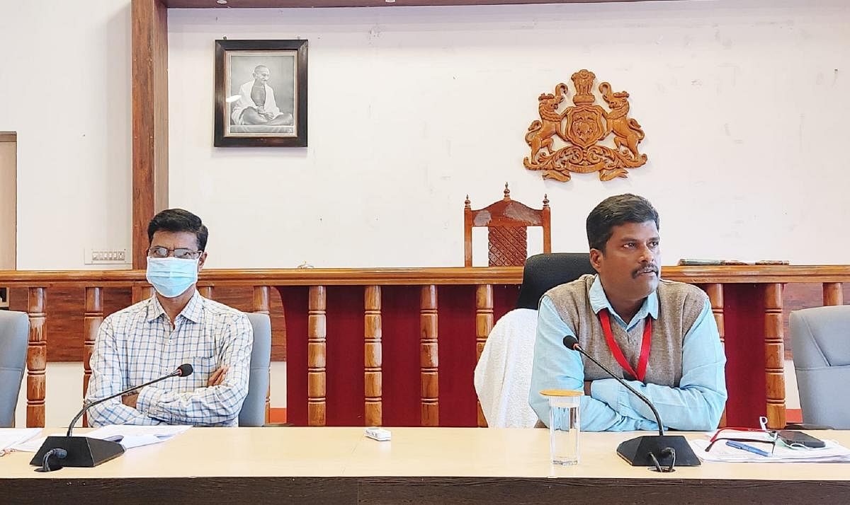 Deputy Commissioner Dr B C Sateesha chairs a meeting with the religious heads in Madikeri.