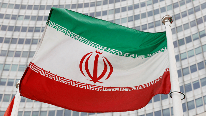 The Iranian flag waves in front of the International Atomic Energy Agency (IAEA) headquarters, in Vienna. Credit: Reuters File Photo