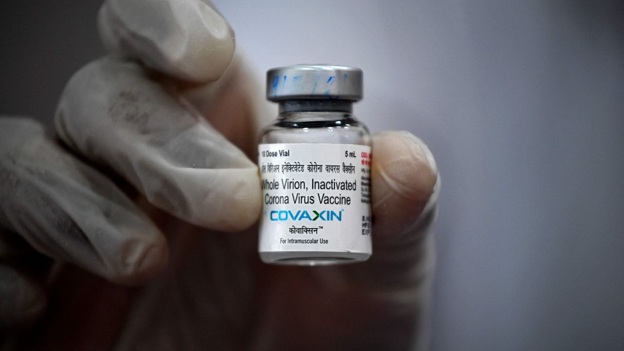 A medical worker displays a vial of the Covaxin vaccine against Covid-19. Credit: AFP File Photo