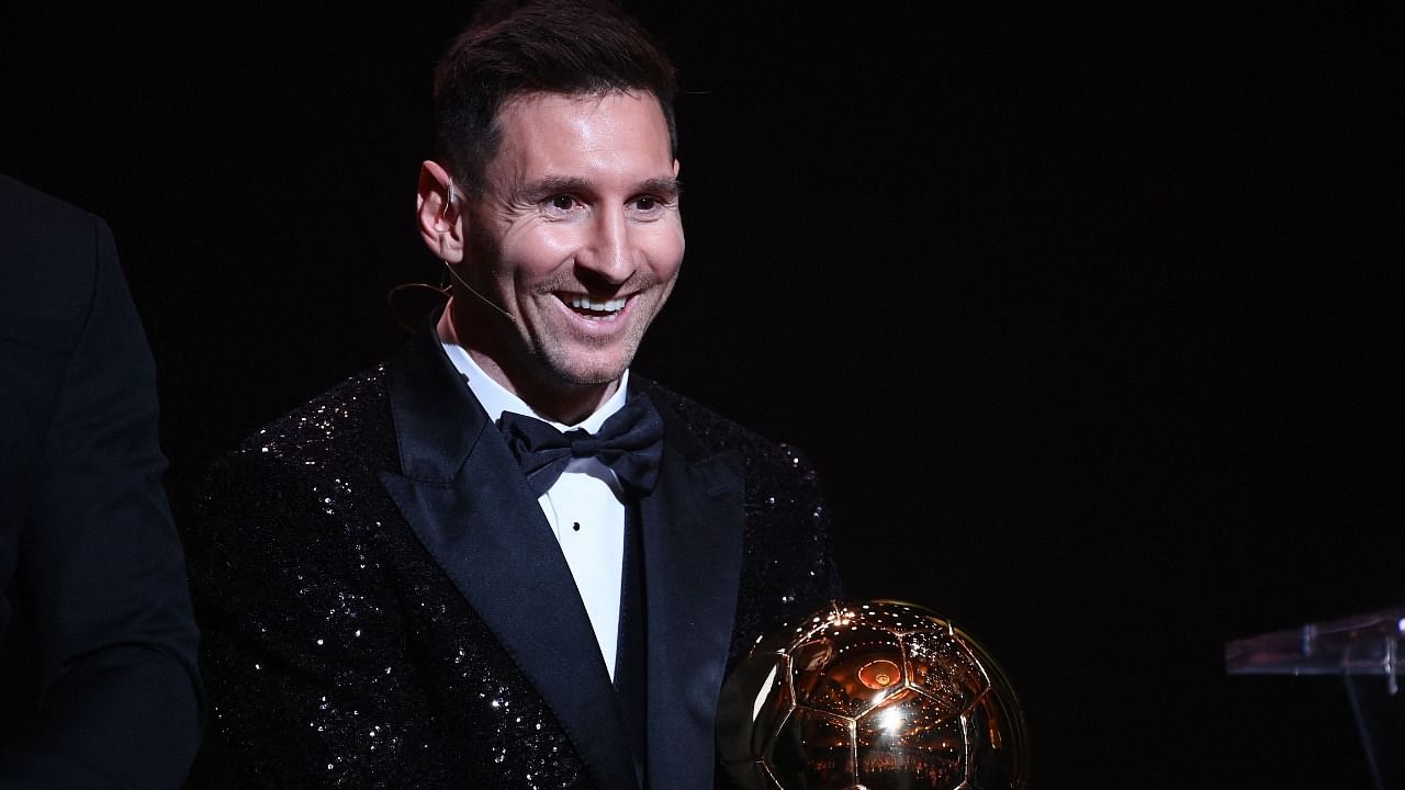 Messi poses after being awarded the the Ballon d'Or award. Credit: AFP Photo