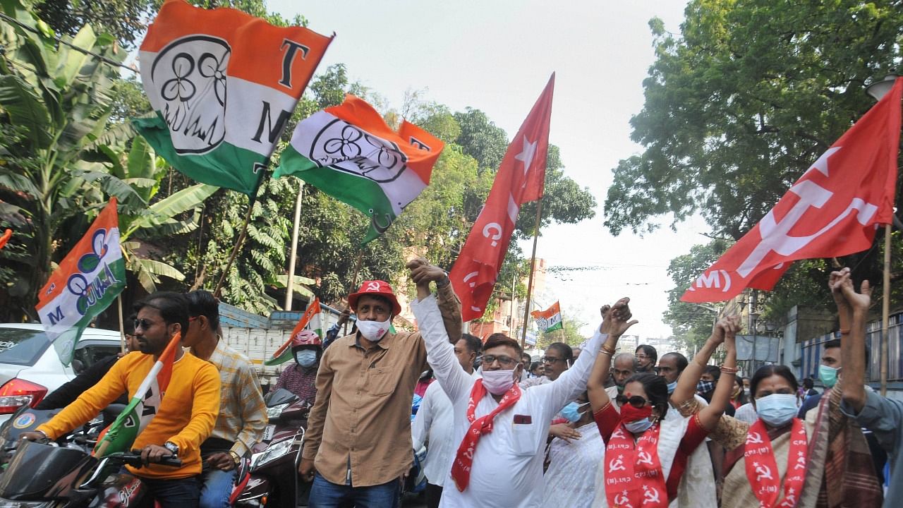 TMC and CPI(M) members on their way to file nominations for the local body polls. Credit: PTI Photo