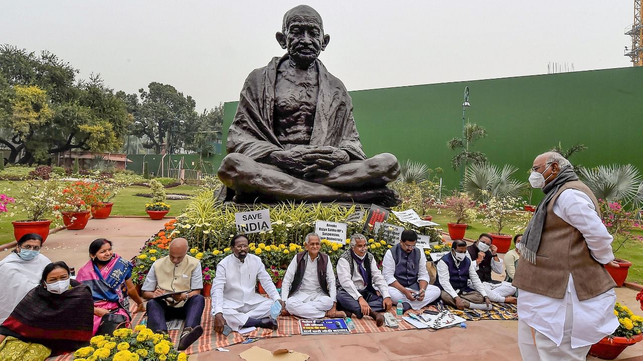 The suspended MPs stage a sit-in in the Parliament Complex. Credit: PTI Photo