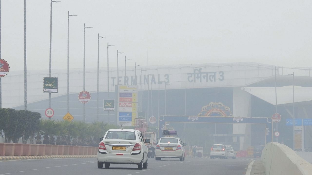 Commuters drive amidst morning haze and toxic smog in New Delhi. Credit: IANS Photo