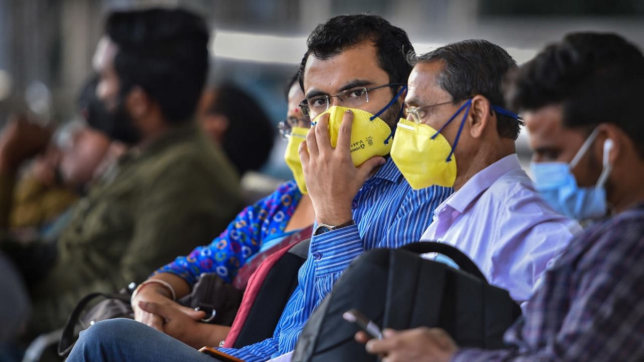 File Photo of passengers wearing face mask at Chennai airport. Credit: PTI Photo