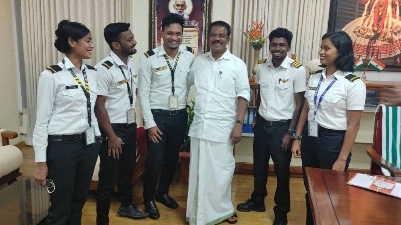 State Minister for SC/ST K Radhakrishnan with two girls and three boys from the Scheduled Caste community who got admission to the academy. Credit: IANS Photo