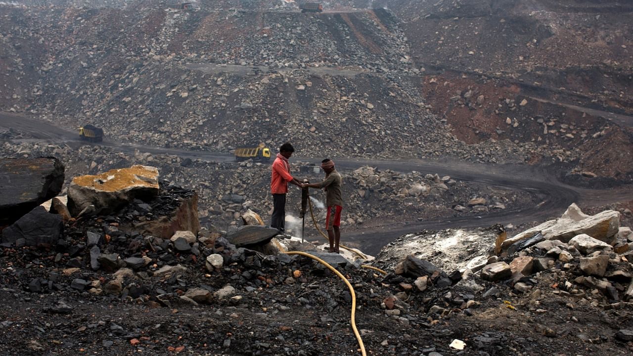 Workers drill at an open cast coal field at Dhanbad district in the eastern Indian state of Jharkhand. Credit: Reuters File Photo