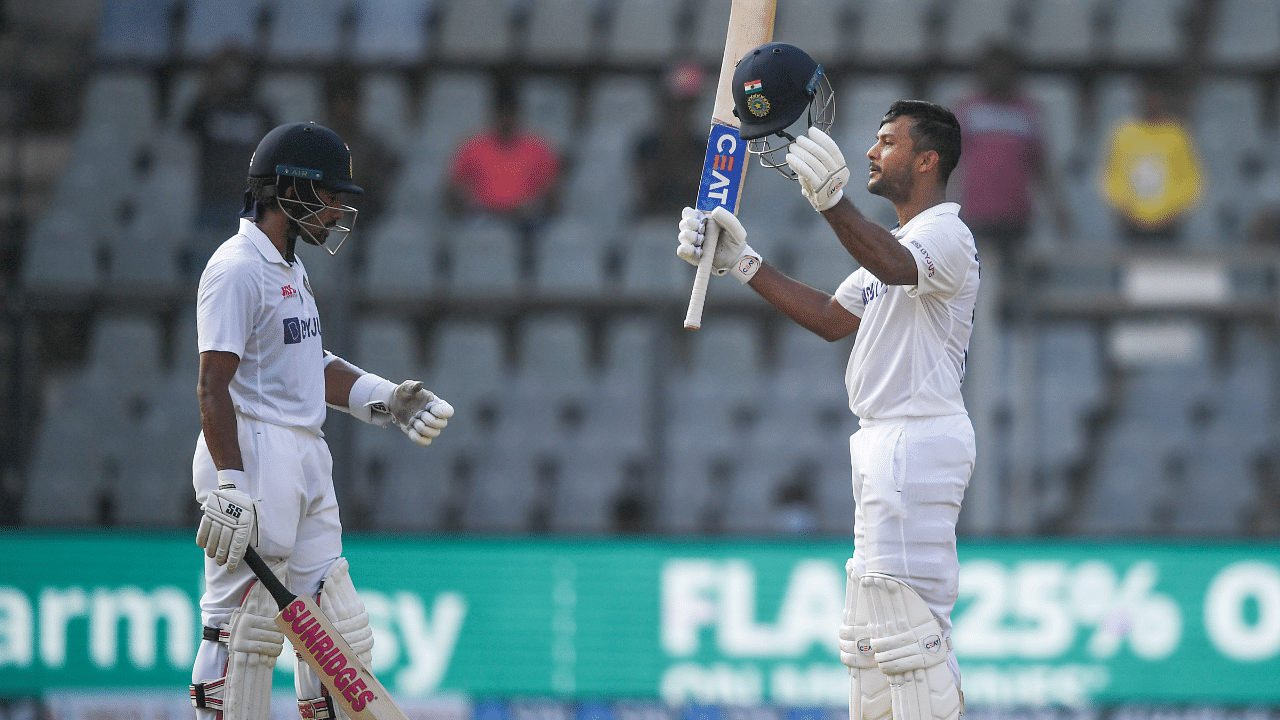 Indian batter Mayank Agarwal celebrates his century on the first day of 2nd Test match played between India and New Zealand at Wankhede stadium. Credit: PTI Photo