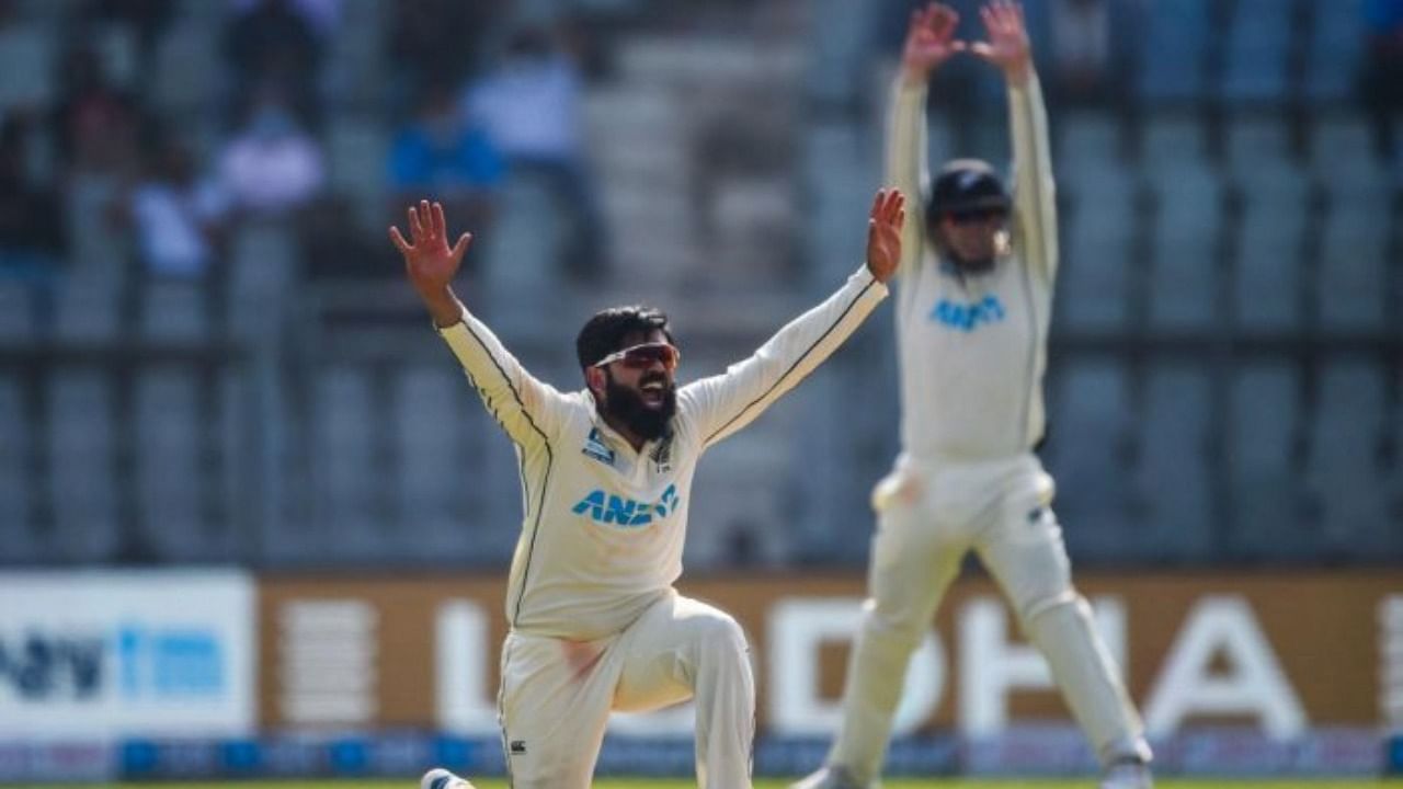 New Zealand's Ajaz Patel (C) celebrates after dismissing India's captain Virat Kohli (not pictured) during the first day of the second Test cricket match between India and New Zealand at the Wankhede Stadium in Mumbai on December 3, 2021. Credit: AFP Photo