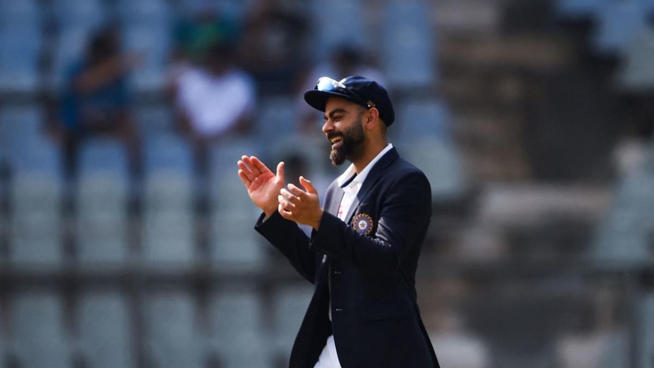 India's captain Virat Kohli reacts after the toss during the first day of the second Test cricket match between India and New Zealand at the Wankhede Stadium in Mumbai on December 3, 2021. Credit: AFP Photo
