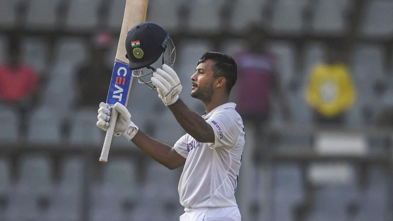 Mayank Agarwal celebrates his century on the first day of 2nd Test match played between India and New Zealand at Wankhede stadium, in Mumbai. Credit: PTI Photo