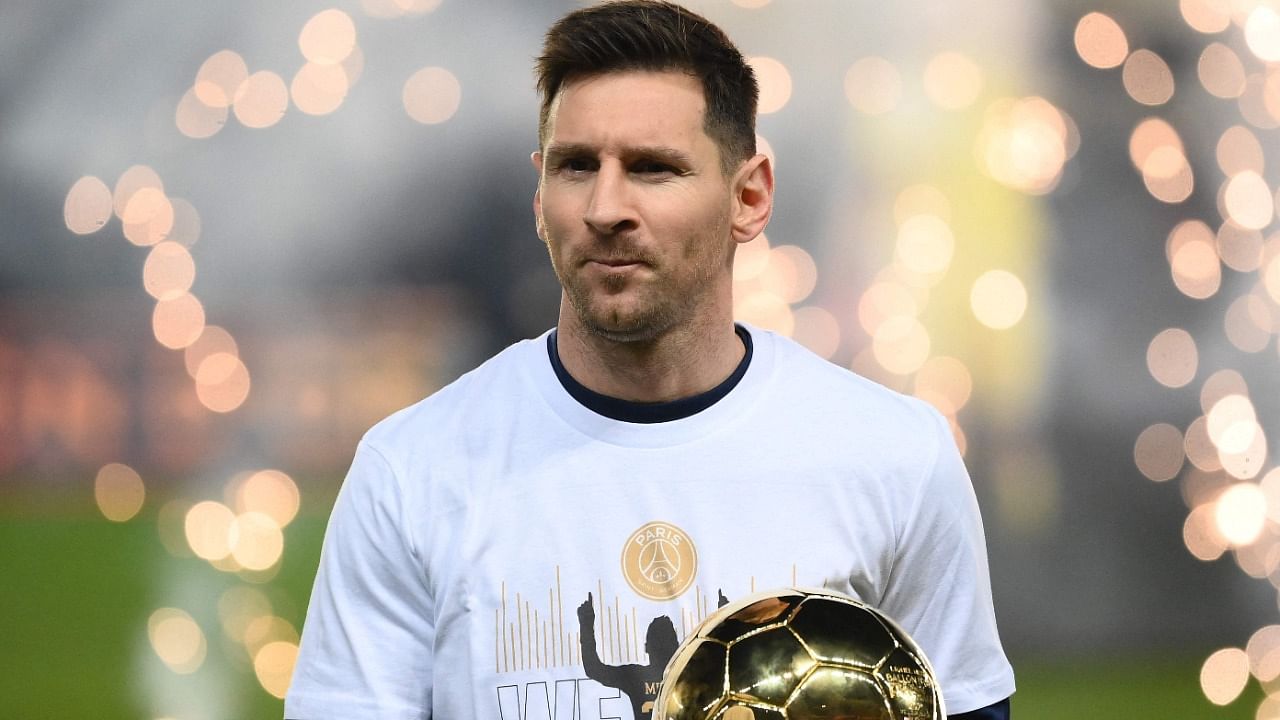 Messi presents his men's Ballon d'Or award. Credit: AFP Photo