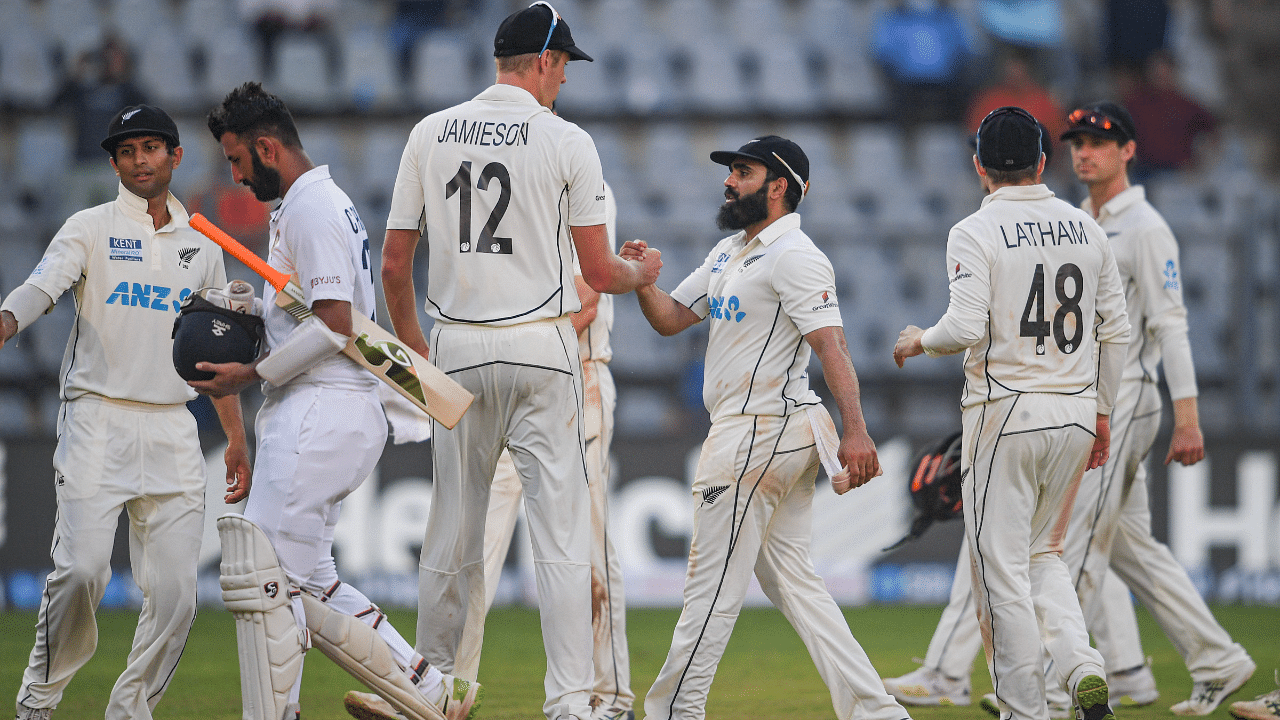 New Zealand's bowler Ajaz Patel with teammates after taking ten wickets in an innings. Credit: PTI Photo
