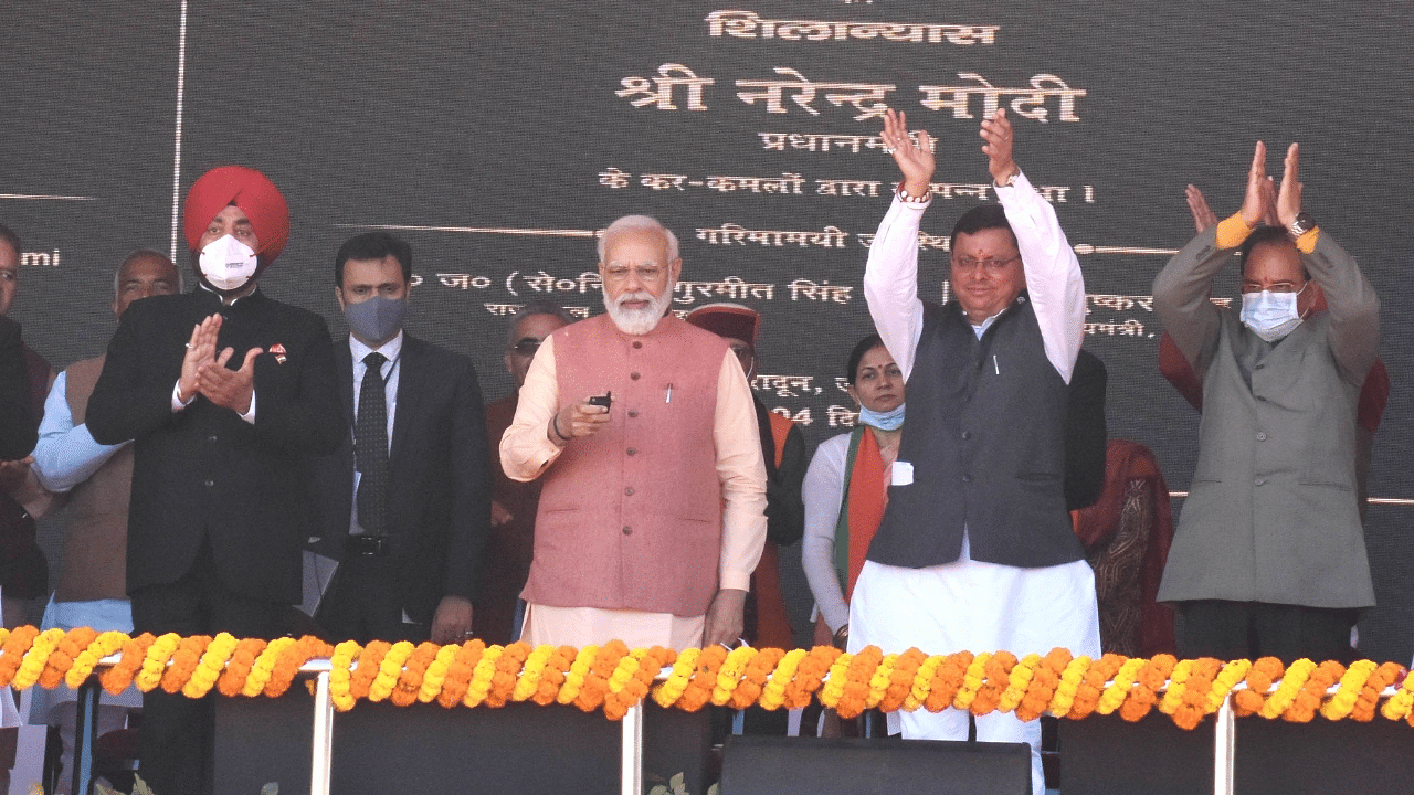 Prime Minister Narendra Modi with Uttarakhand Chief Minister Pushkar Singh Dhami and others during BJP election campaign rally ahead of state Assembly Election 2022. Credit: IANS Photo