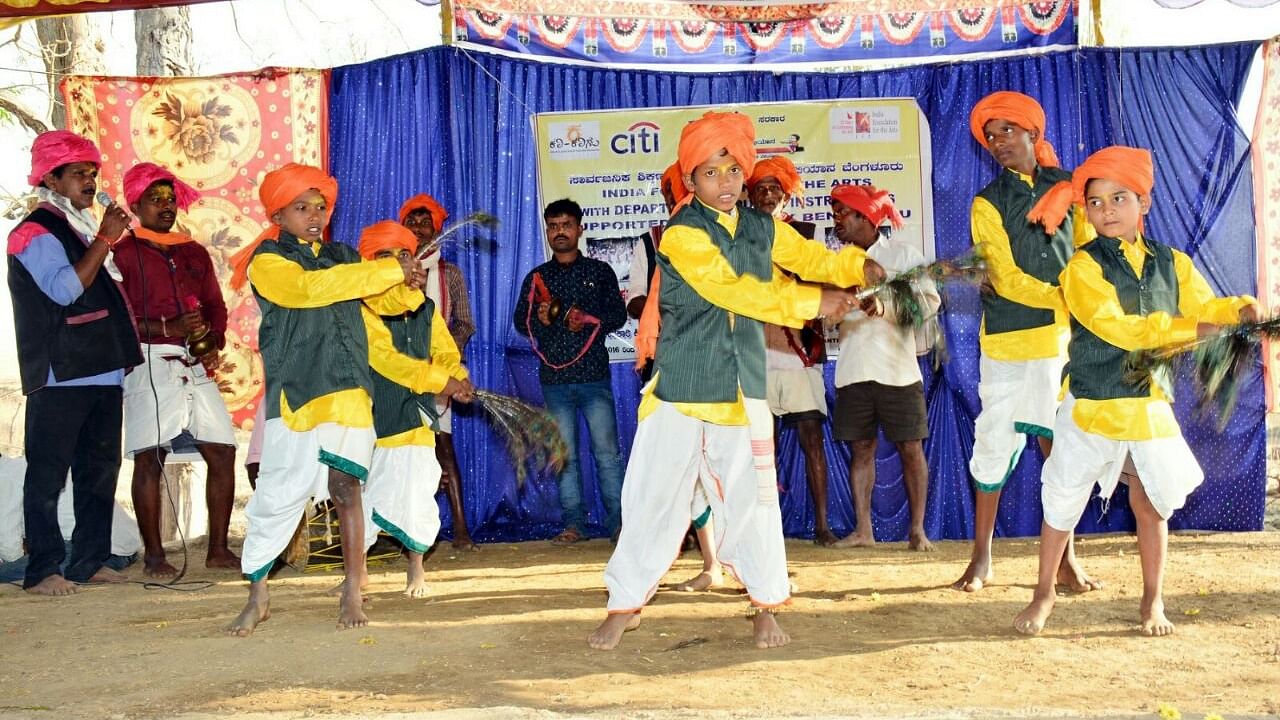 Students perform a traditional dance of the Gouli community at school; Nagaraj Huded’s students showcase their work created as part of art integrated learning at school.