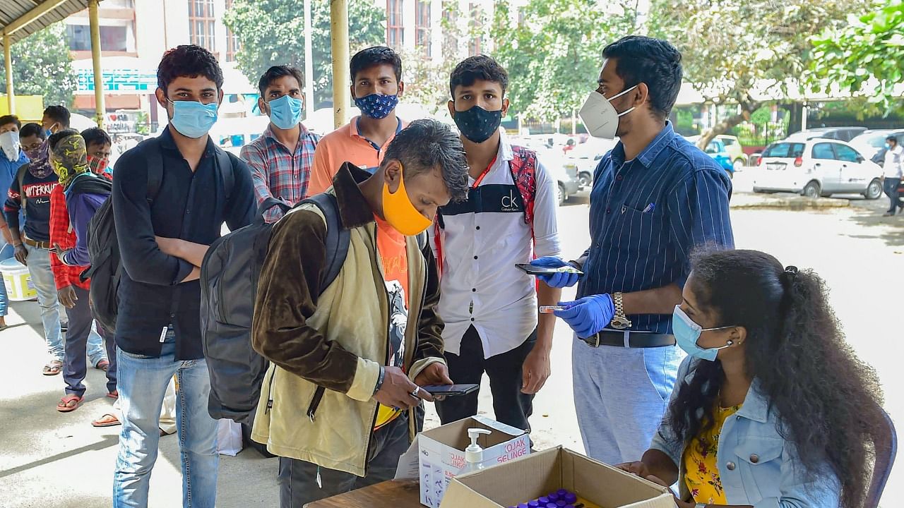 Health worker collect data from commuters at KSR station amid fear of spread of a new variant. Credit: PTI File Photo