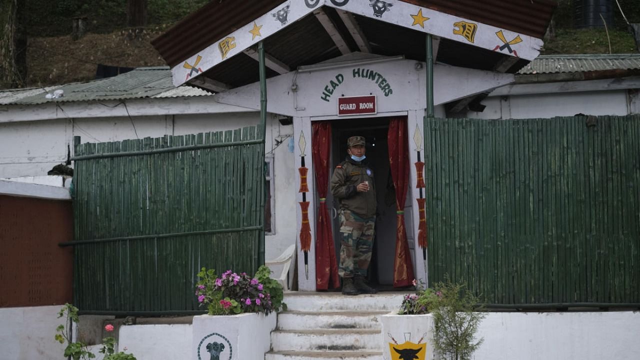 An Indian army soldier stands outside a guard room at an army camp in Jakhama, outskirts of Kohima. Credit: AP/PTI Photo