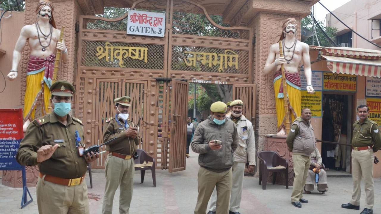 Police personnel guard outside the Sri Krishna Janambhoomi temple in Mathura, Sunday, Dec 5, 2021. Security has been tightened in Mathura after Akhil Bharat Hindu Mahasabha announced its plan to perform ‘jalabhishek’ at Shahi Eidgah in Mathura and install Shri Krishna idol. Credit: PTI Photo