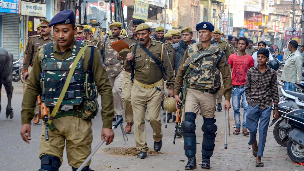 Security personnel conduct a flag march after some right-wing groups threatened to install an idol of Lord Krishna inside the Shahi Idgah mosque on December 6, the anniversary of the Babri Masjid demolition, in Mathura, Tuesday, November 30, 2021. Credit: PTI File Photo