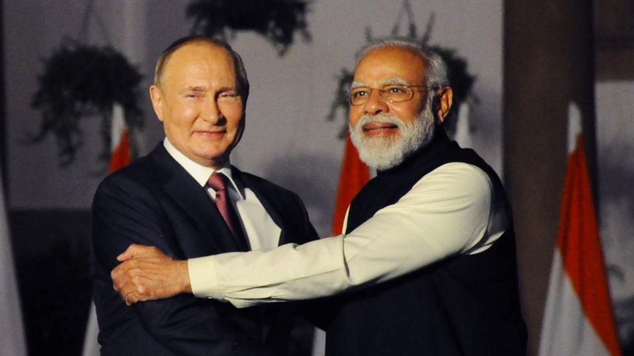 Russian President Vladimir Putin, left and Indian Prime Minister Narendra Modi greet each other before their meeting in New Delhi,on, Monday, Dec.6, 2021. Credit: IANS Photo