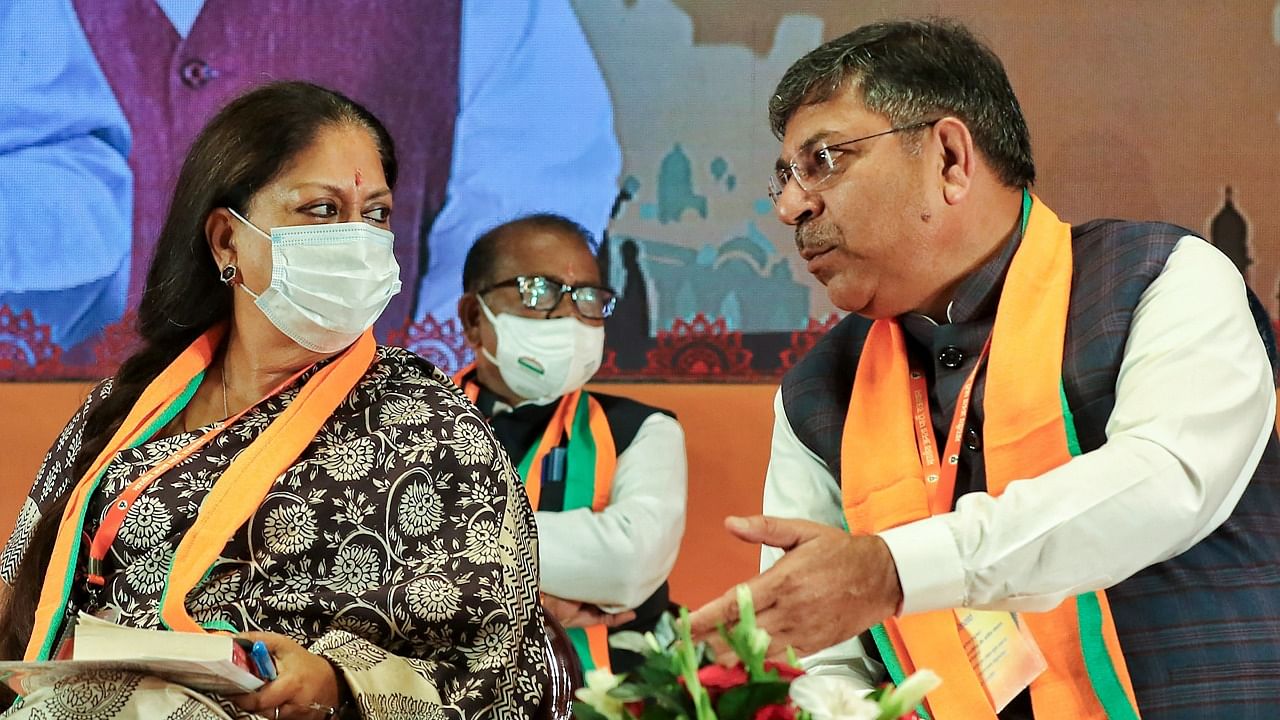 Sources have indicated a power tussle between former CM Vasundhara Raje (Left) and BJP's state president Satish Poonia (Right). Credit: PTI Photo