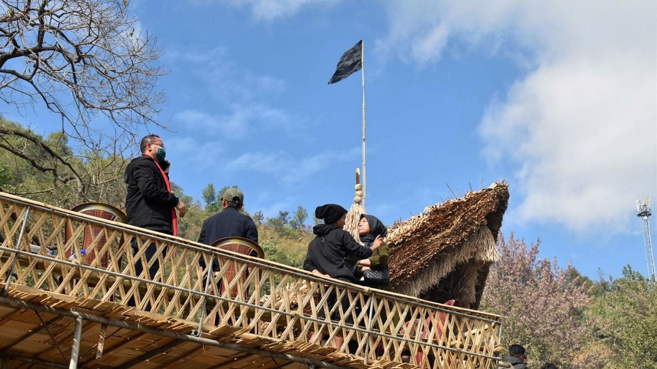 People raise black flags in Kisama of Nagaland to condemn the civilian killings in Mon. Credit: PTI Photo