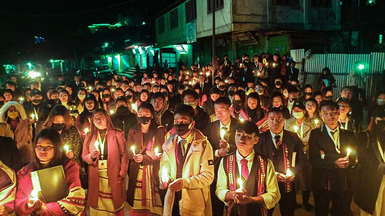 Locals participate in a candle march over the civilian killings in Nagaland. credit: PTI Photo