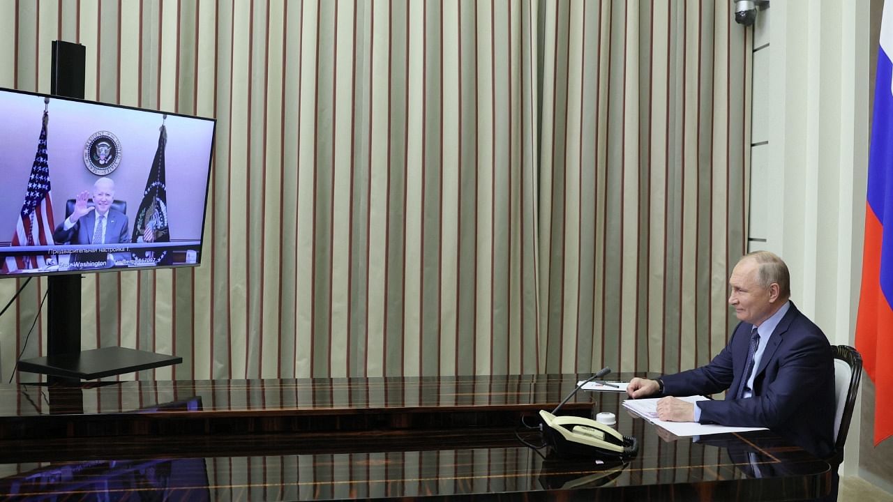 Vladimir Putin and Joe Biden at the virtual summit. Credit: AFP Photo