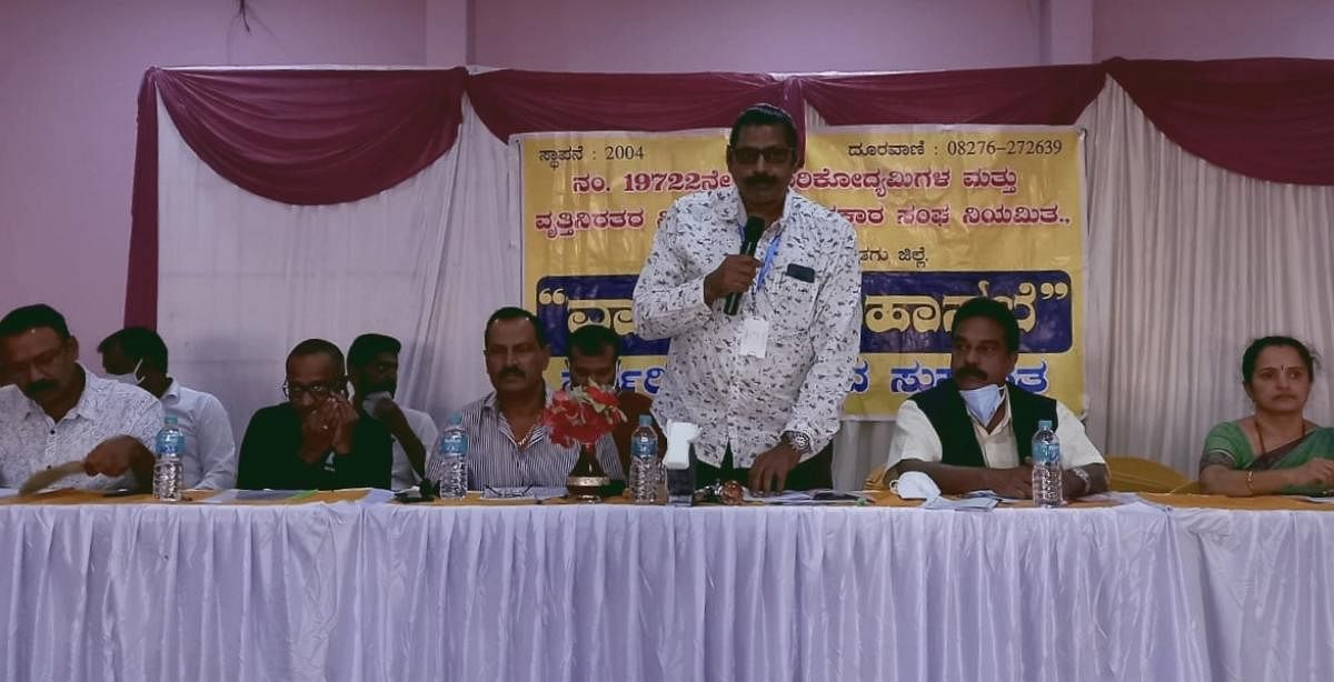 Kaigarikodyamigala Mathu Vrithiniratara Vividdhoddesha Sahakara Sangha president T R Sharavana Kumar speaks at the annual meeting of the society in Kushalnagar.