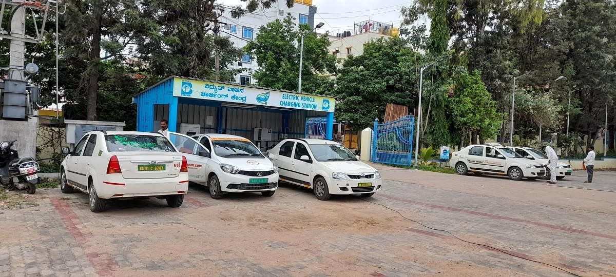 Taxis being charged at the HSR Layout division of Bescom. Photos: EV cell, Bescom
