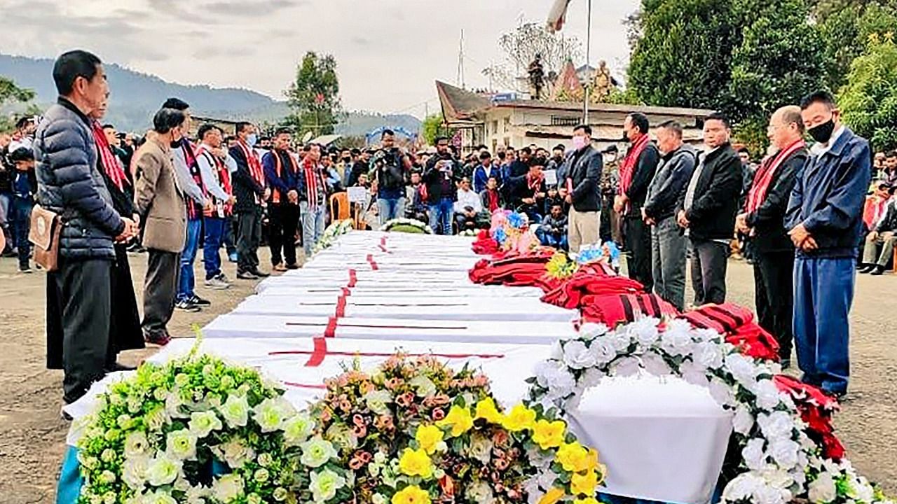 Relatives and locals pay last tributes to the 13 people who were killed. Credit: PTI Photo