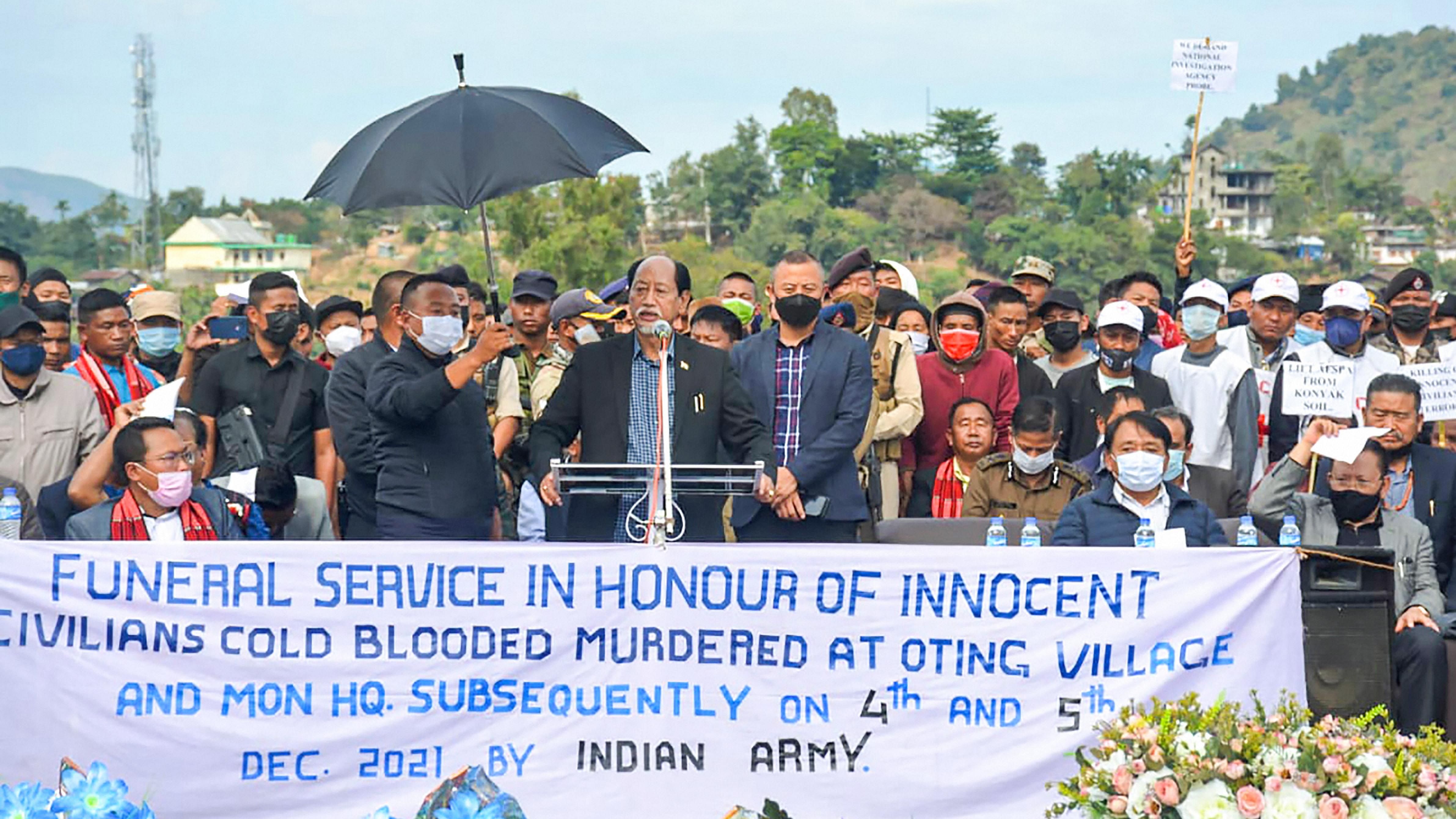 Nagaland Chief Minister Neiphiu Rio addresses the funeral of the 13 people who were allegedly killed by Armed Forces, in Mon district. Credit: PTI Photo