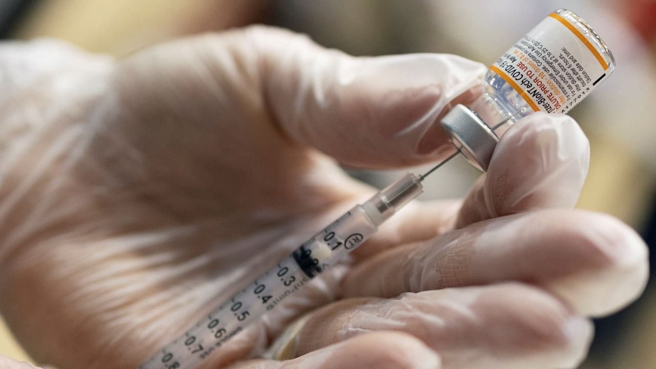 A vaccinator draws a Pfizer-BioNTech Covid-19 vaccine. Credit: Reuters File Photo