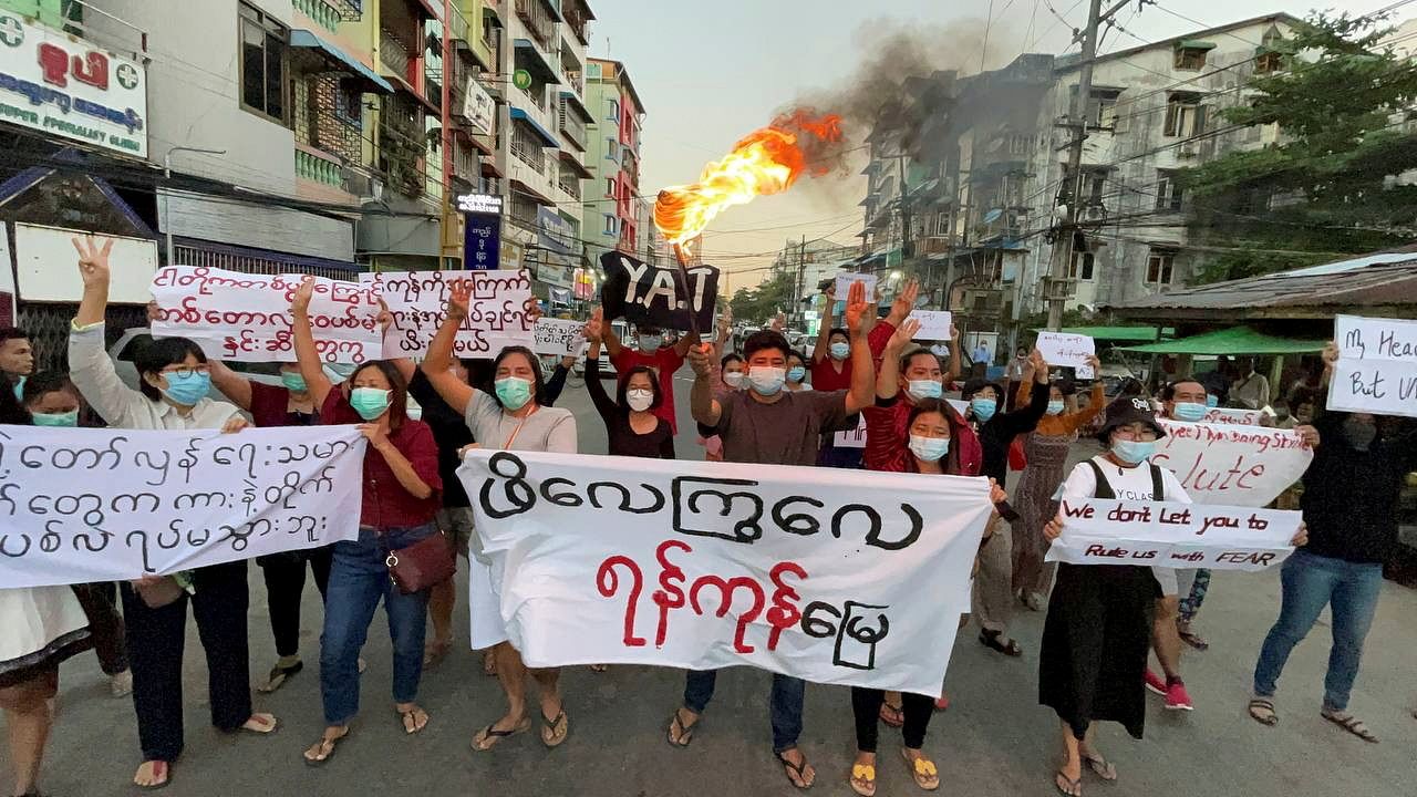 Protesters march against Aung San Suu Kyi's verdict, in Yangon, Myanmar. Credit: Reuters Photo