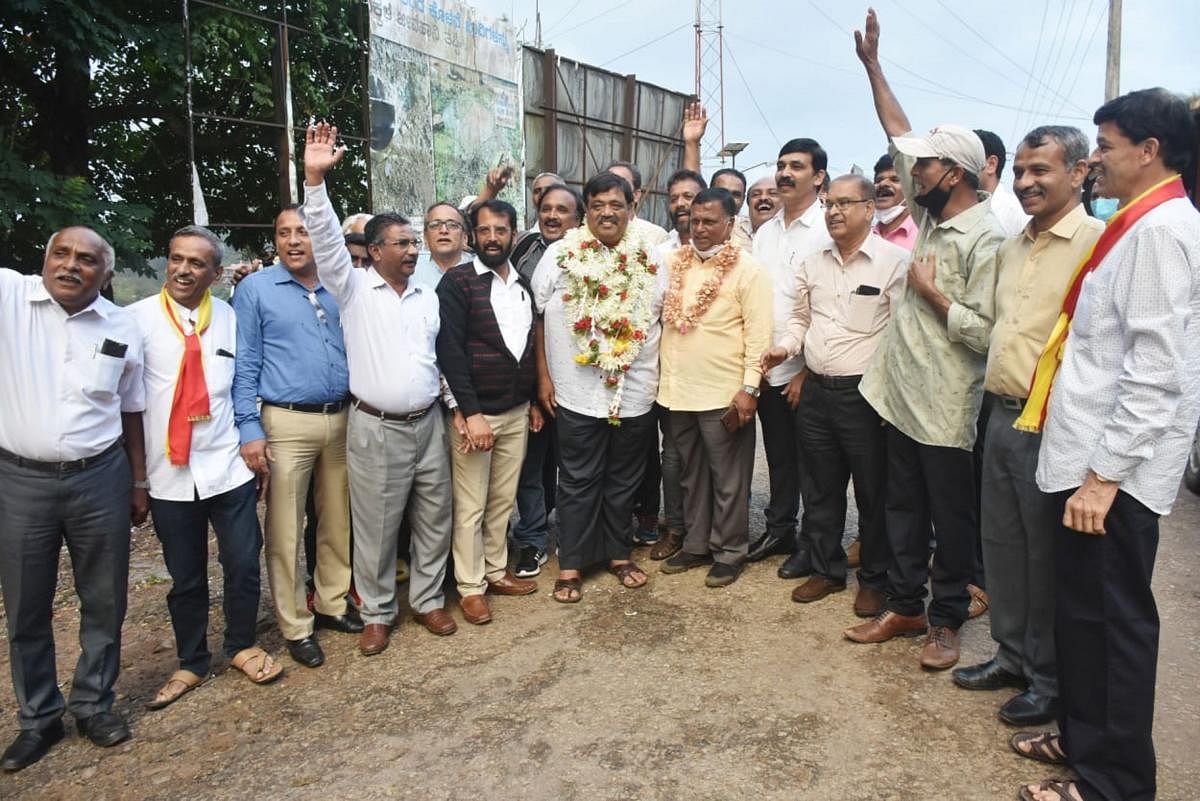 Supporters of Keshav Kamath rejoice outside the counting centre and greet the newly elected president.