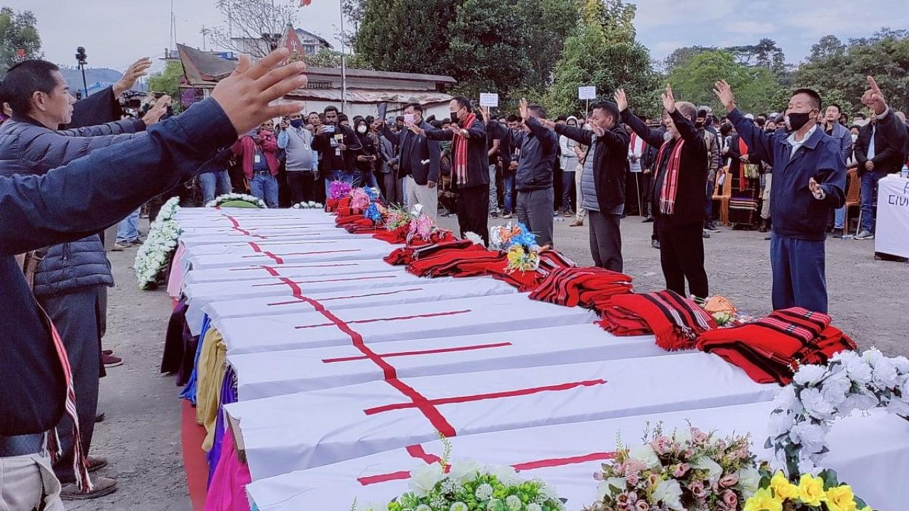 People attend a mass funeral of civilians that were mistakenly killed by security forces, in Mon district. Credit: Reuters Photo