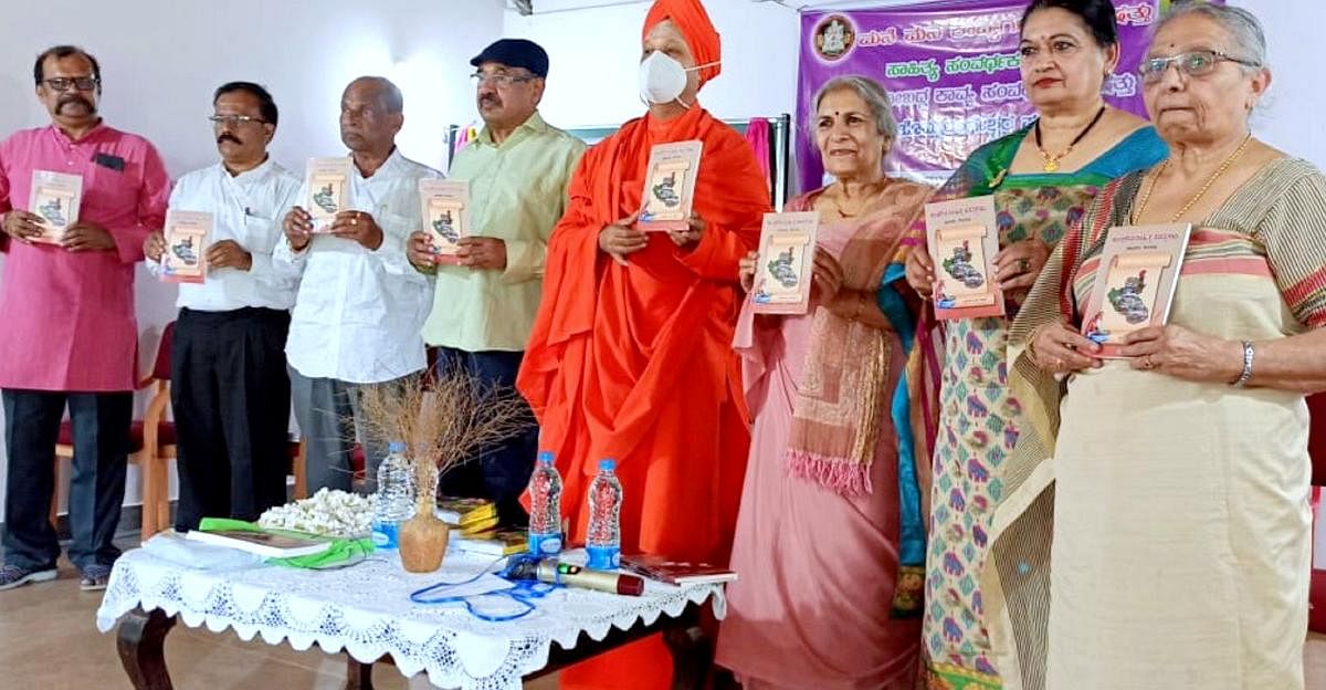 Dignitaries release literary works during a programme held at SMS Vidya Samsthe near Virajpet.