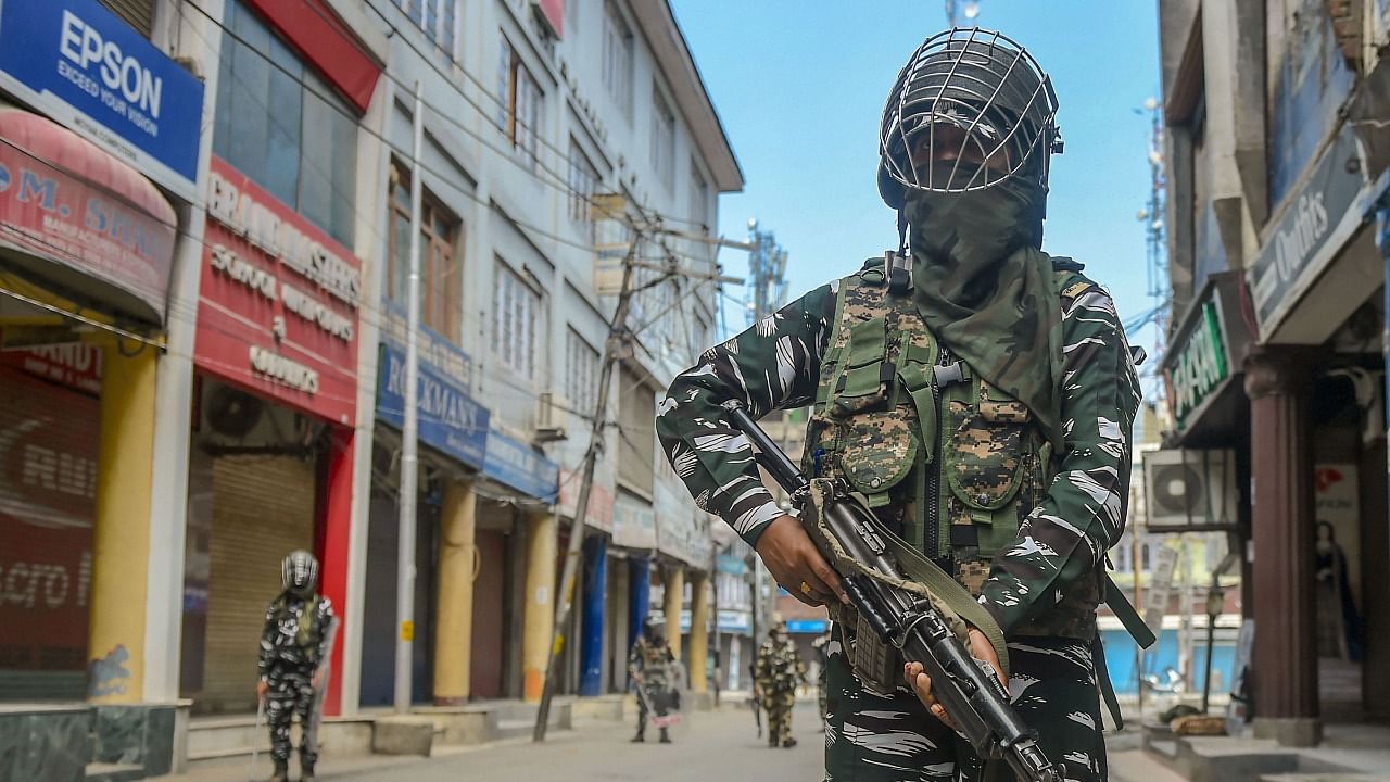 Women CRPF personnel stand guard on a street during restrictions imposed in the wake of the first anniversary of Article 370 abrogation, in Srinagar. Credit: PTI File Photo